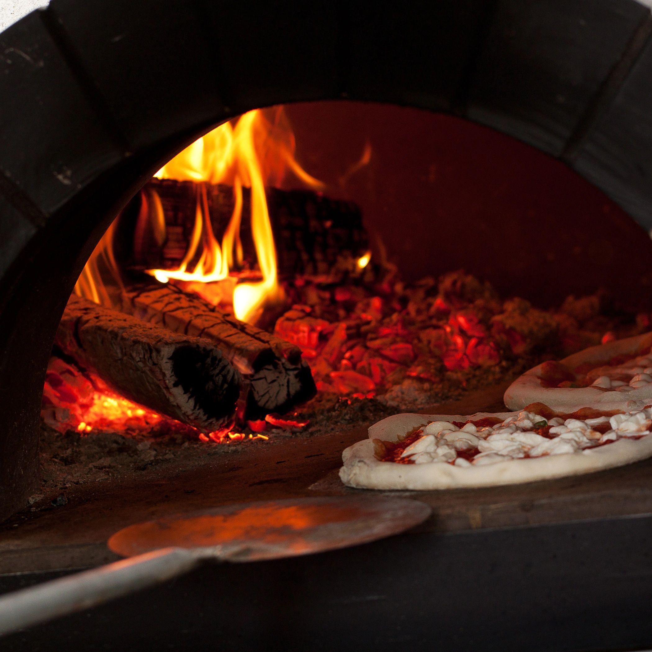 Italian pizza baked in a wood-burning oven