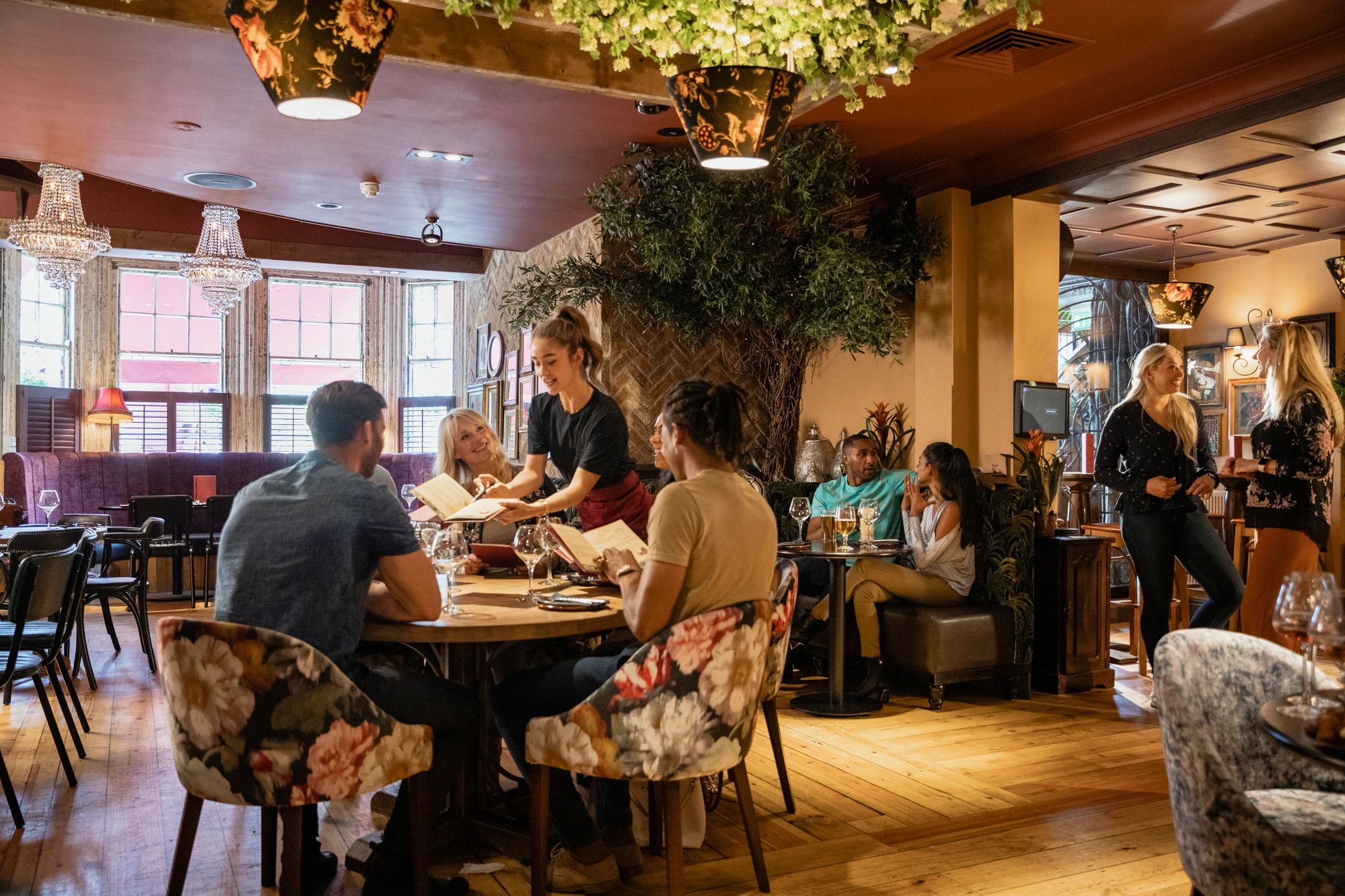Guests enjoying dinner in an elegant restaurant dining room