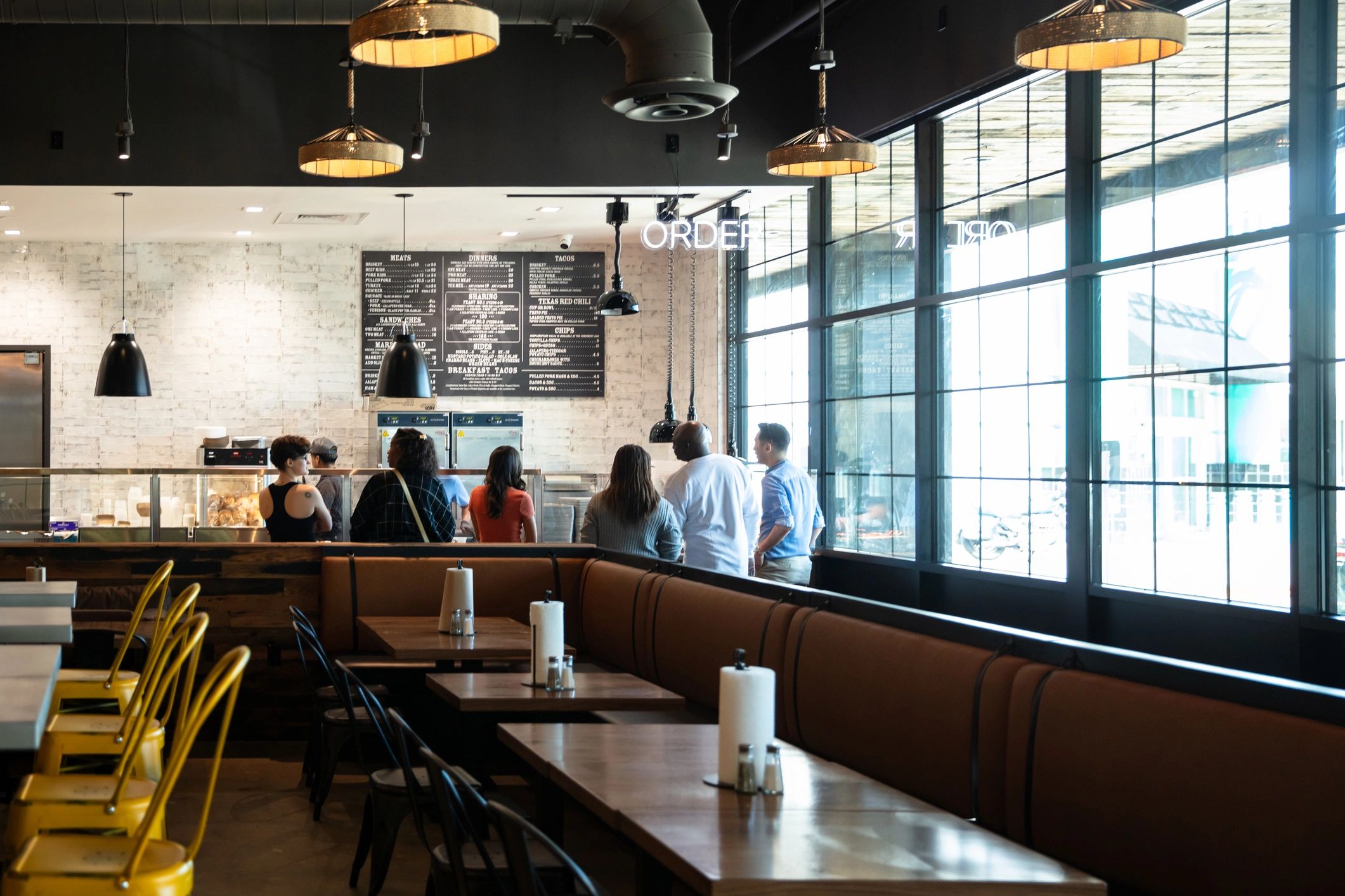 Restaurant guests in a lively dining setting