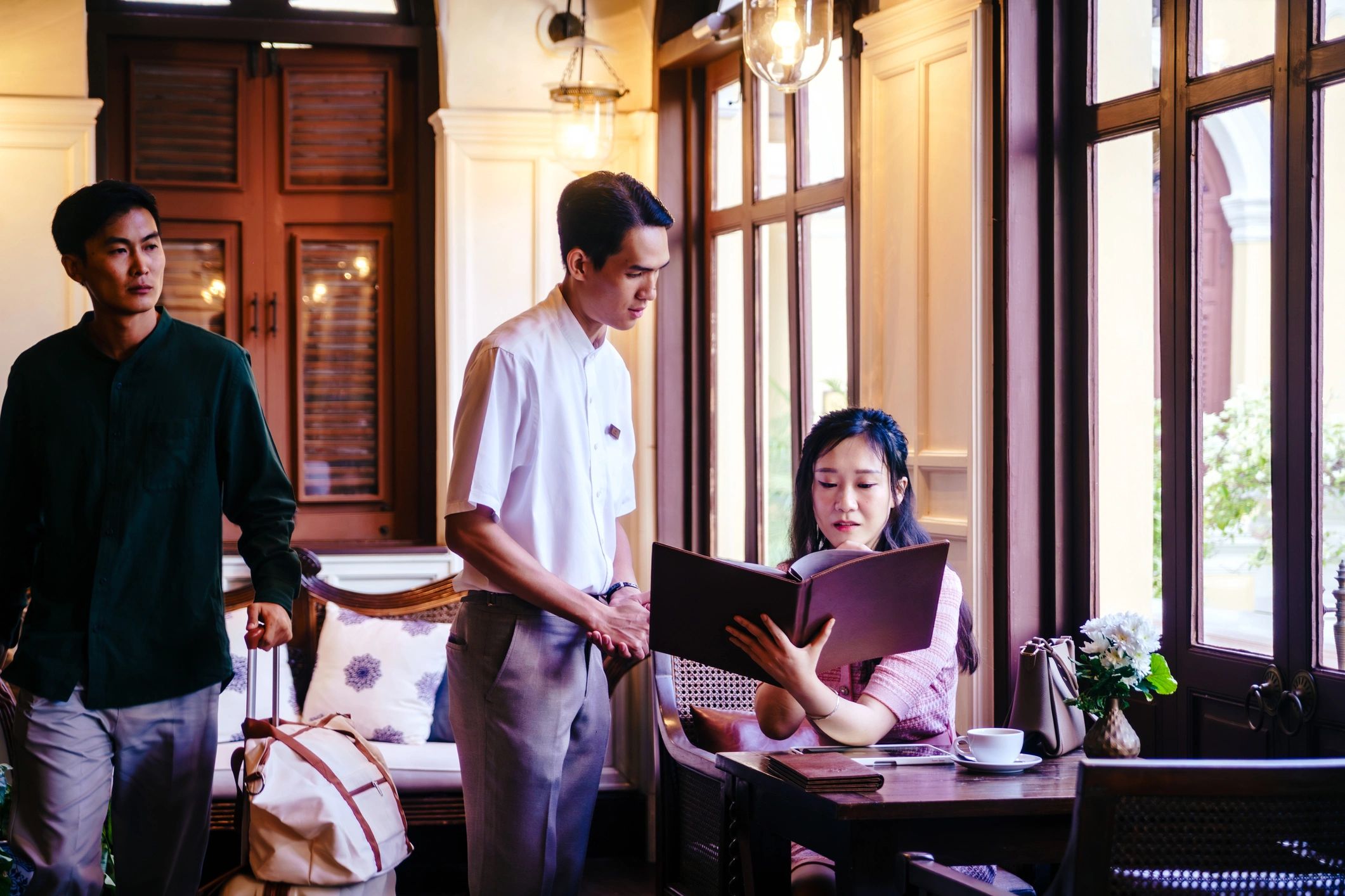 Restaurant staff serving guests with attentive hospitality