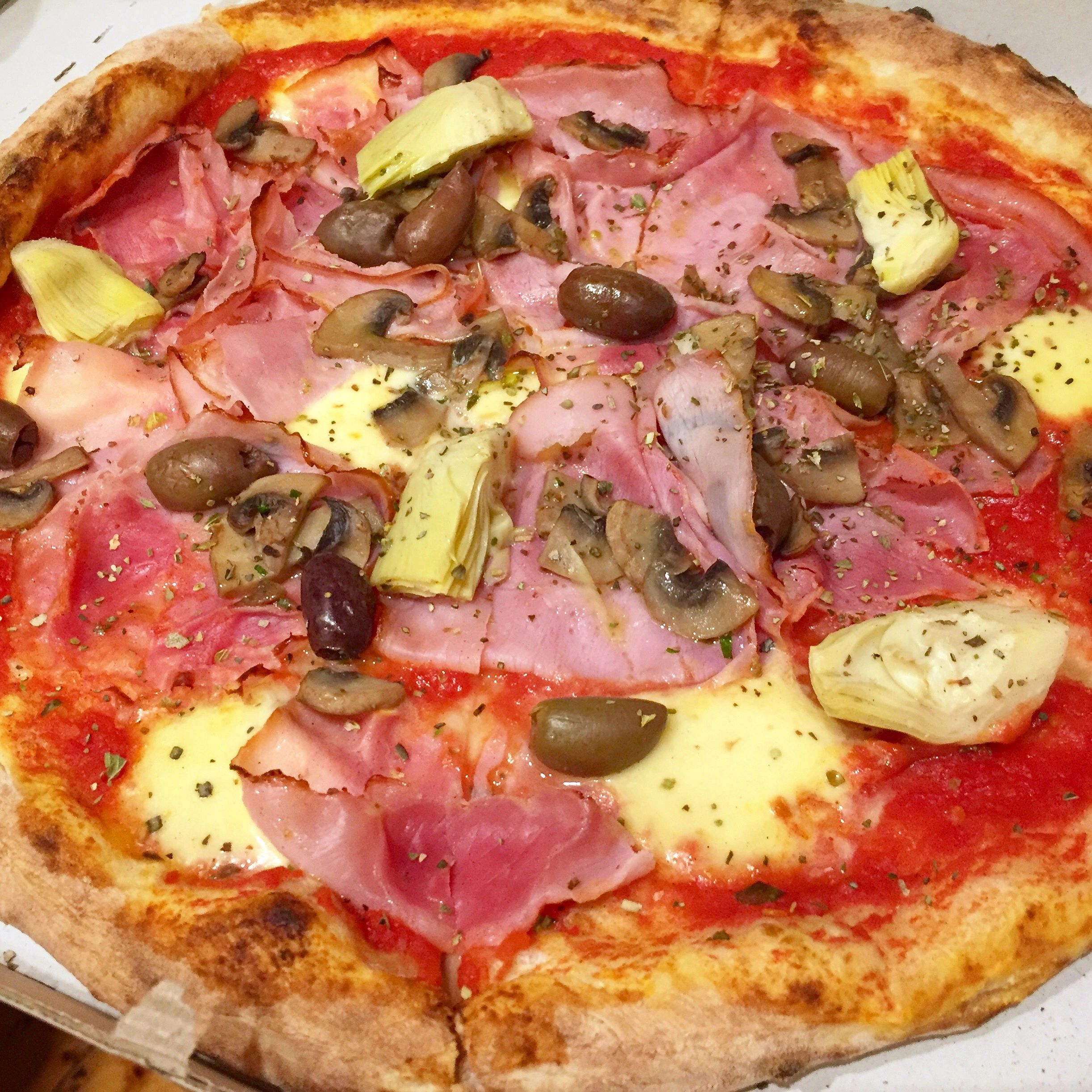 Wood-fired pizza with toppings